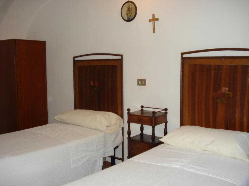 Postel nebo postele na pokoji v ubytování Santuario di Oropa