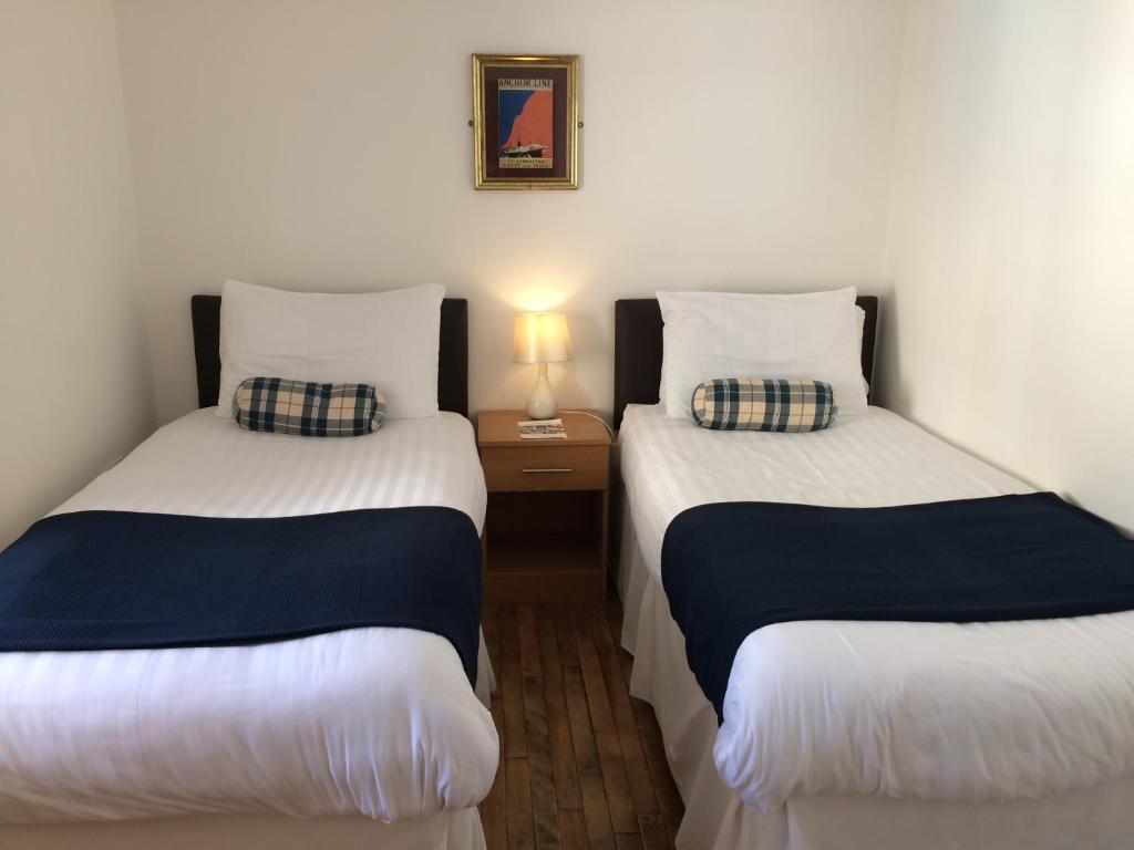 Postel nebo postele na pokoji v ubytování Starfish Rooms