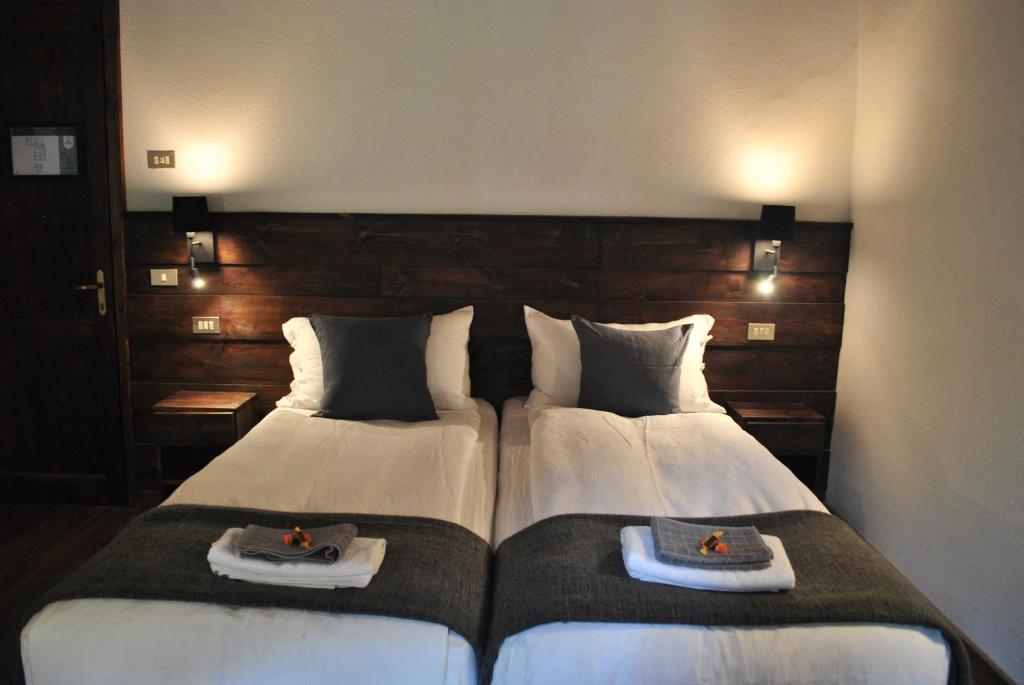 Postel nebo postele na pokoji v ubytování Hotell Millefiori- Alpine Event Lodge