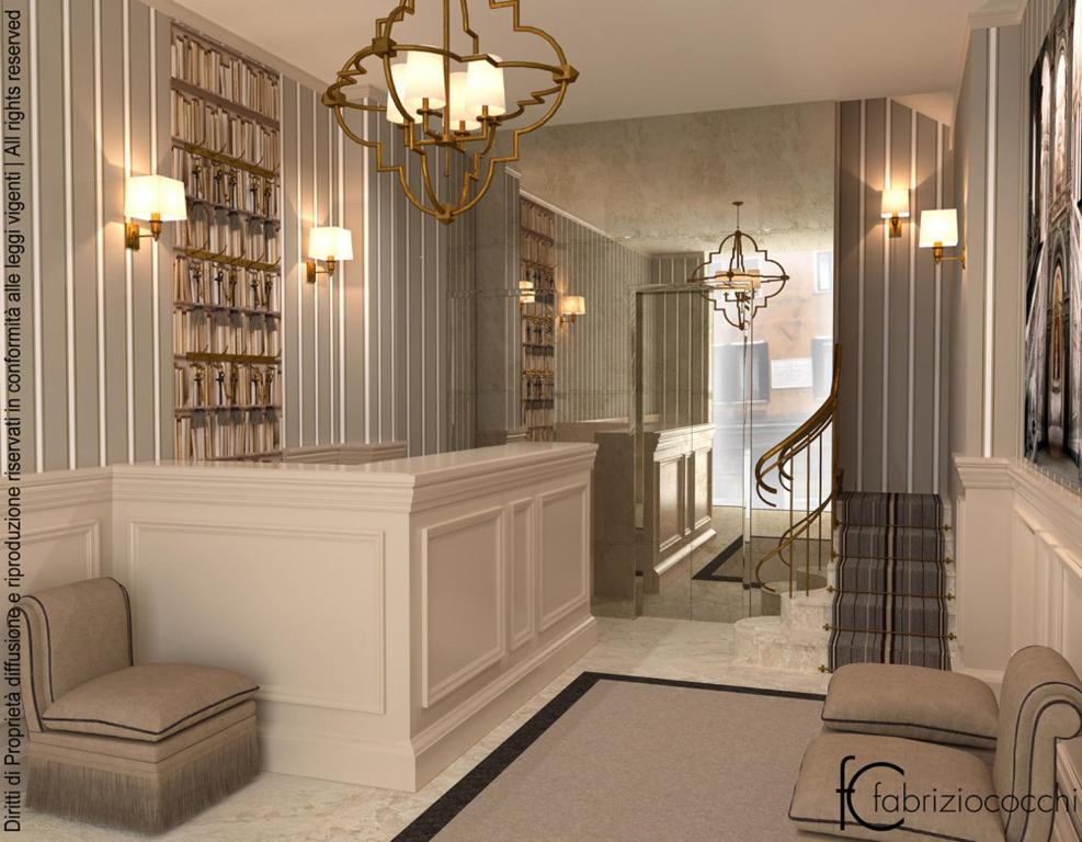 eine Lobby mit einer Treppe und einem Kronleuchter in der Unterkunft Hotel Bartolomeo in Venedig