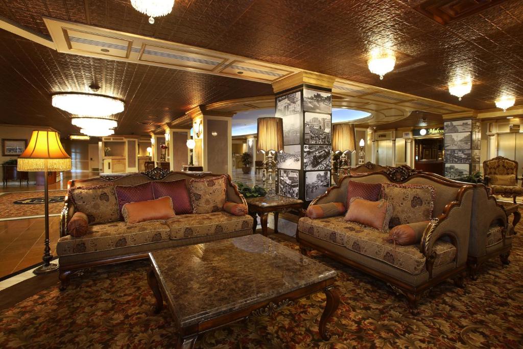 a living room with two couches and a table at The Claridge Hotel in Atlantic City