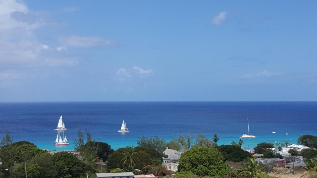 a view of the ocean with sailboats in the water at Spectacular Ocean View Retreat in Saint James
