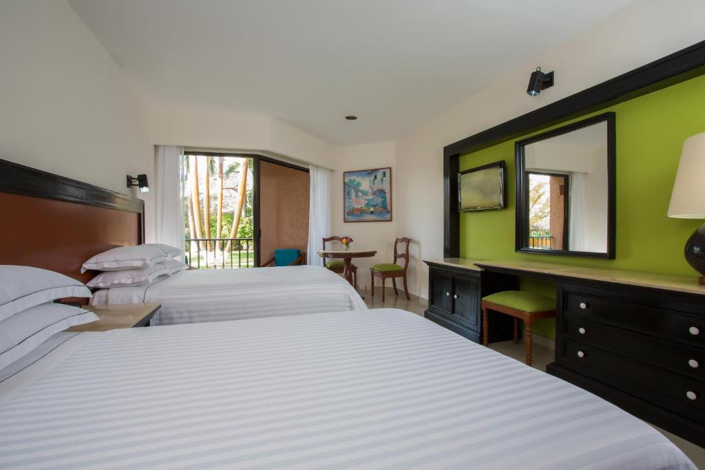 Postel nebo postele na pokoji v ubytování Barceló Huatulco - All Inclusive