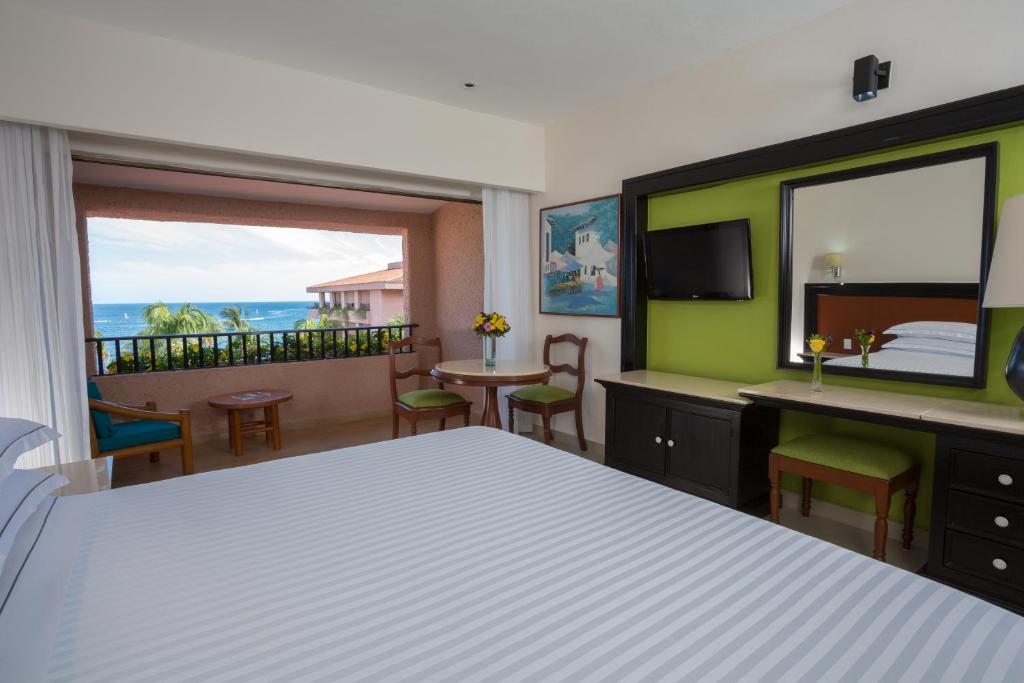 Postel nebo postele na pokoji v ubytování Barceló Huatulco - All Inclusive