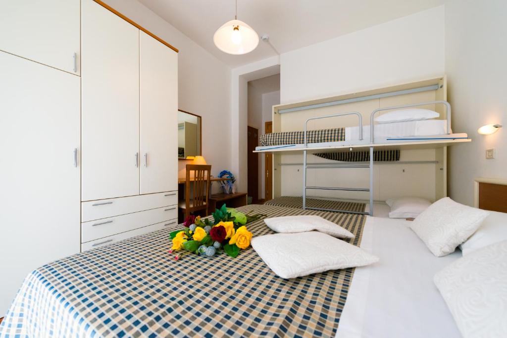 Postel nebo postele na pokoji v ubytování Hotel Lem-Casadei