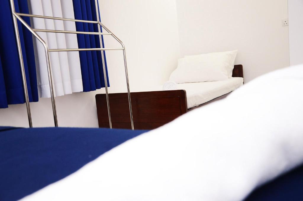Postel nebo postele na pokoji v ubytování Nil Vimana Villa