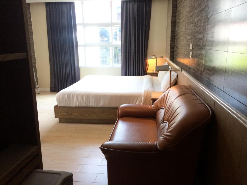 Postel nebo postele na pokoji v ubytování Bourbon St. Boutique Hotel