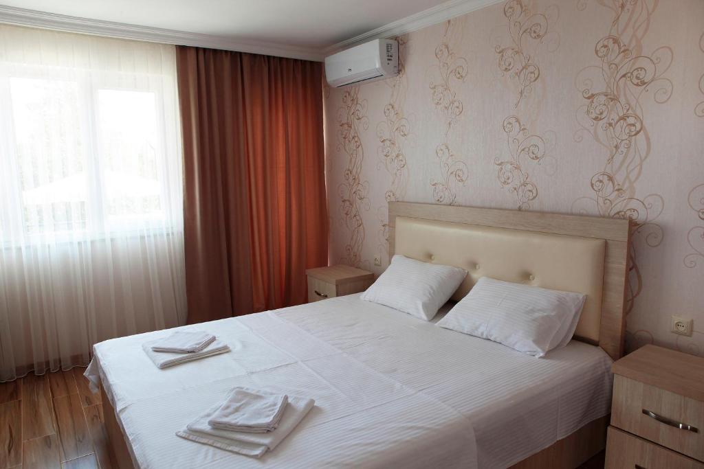 Postel nebo postele na pokoji v ubytování Hotel Botanica