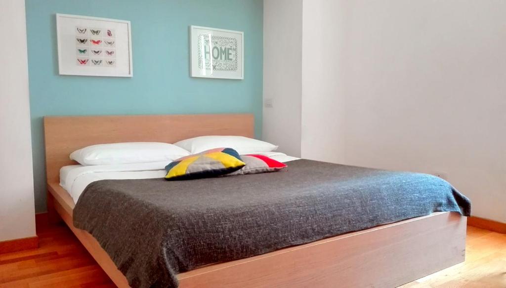 A bed or beds in a room at La Controra Guesthouse Roma