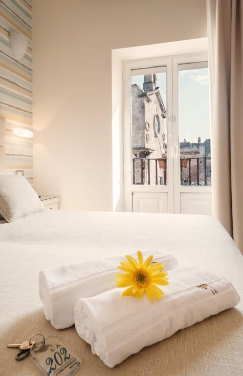 Postel nebo postele na pokoji v ubytování Hotel L'Arcangelo - Boutique Hotel