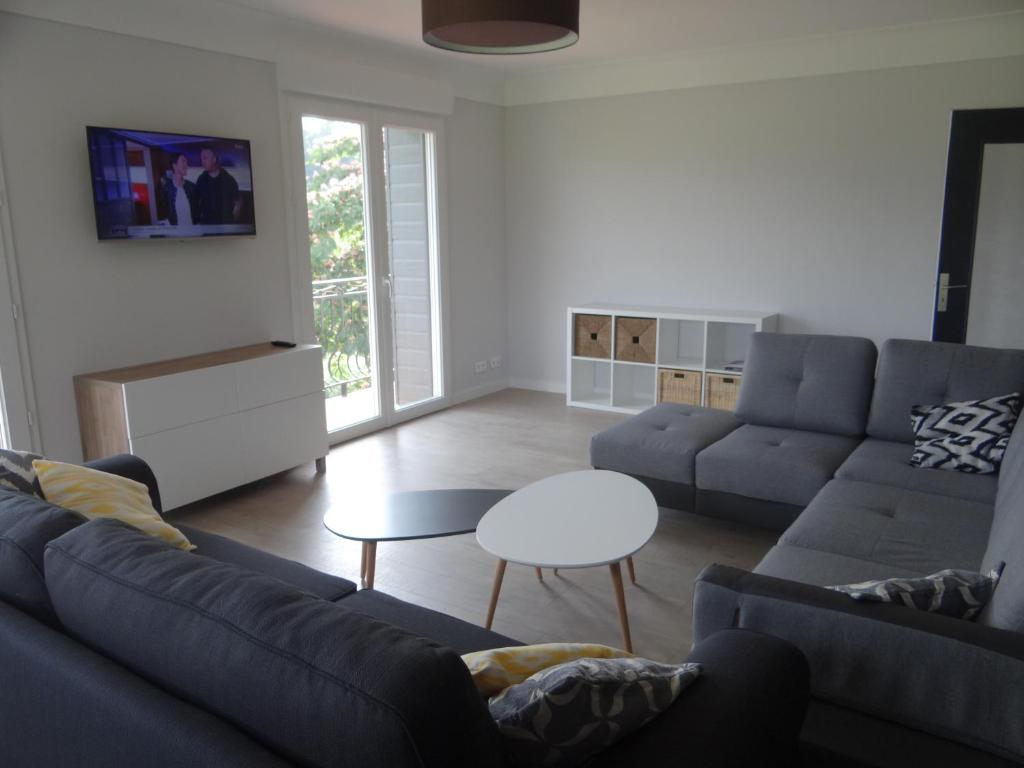 a living room with a couch and a table at Labassere in Labassère