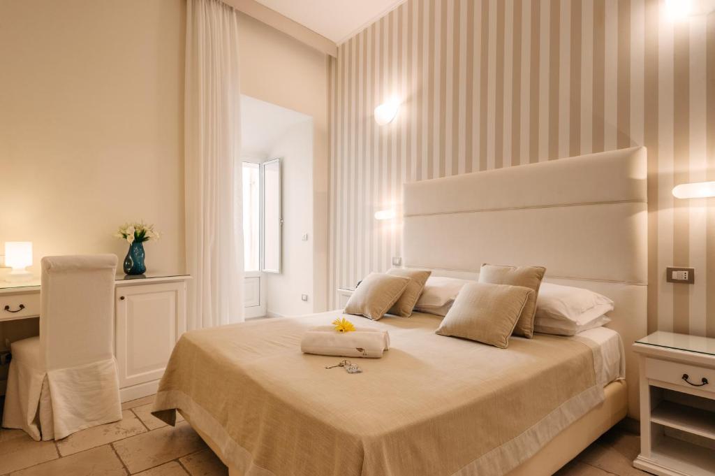 Postel nebo postele na pokoji v ubytování Hotel L'Arcangelo - Boutique Hotel