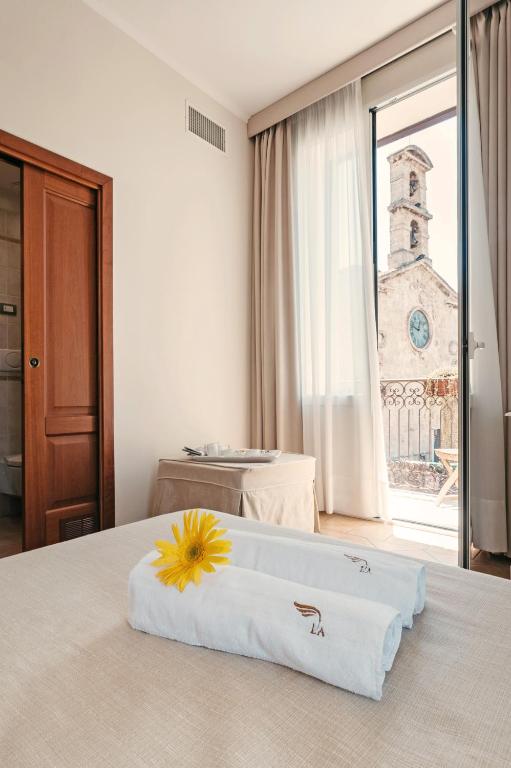 Postel nebo postele na pokoji v ubytování Hotel L'Arcangelo - Boutique Hotel