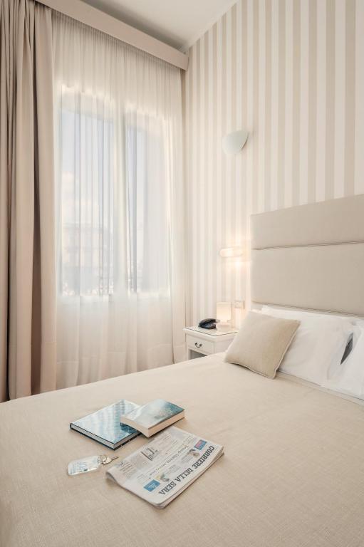 Postel nebo postele na pokoji v ubytování Hotel L'Arcangelo - Boutique Hotel