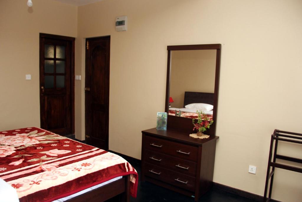 Postel nebo postele na pokoji v ubytování Perera Homestay