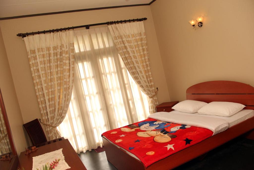 Postel nebo postele na pokoji v ubytování Perera Homestay