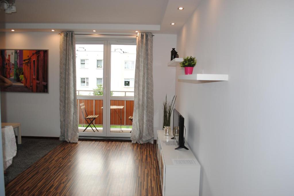 TV a/nebo společenská místnost v ubytování MT Apartments