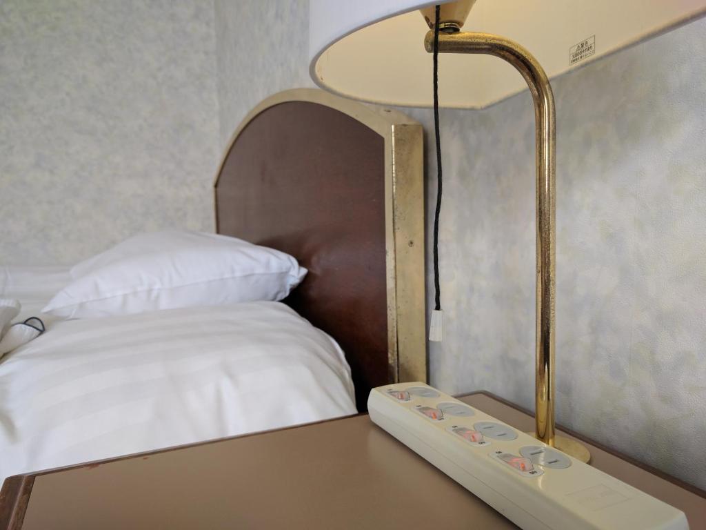 Postel nebo postele na pokoji v ubytování Hotel Harbour Yokosuka