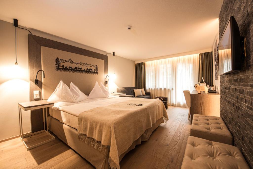 Postel nebo postele na pokoji v ubytování Hotel Daniela