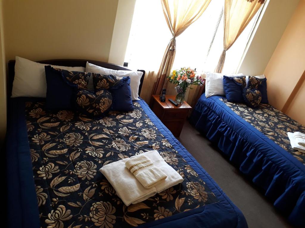 Postel nebo postele na pokoji v ubytování Hotel Residencial El Viajero