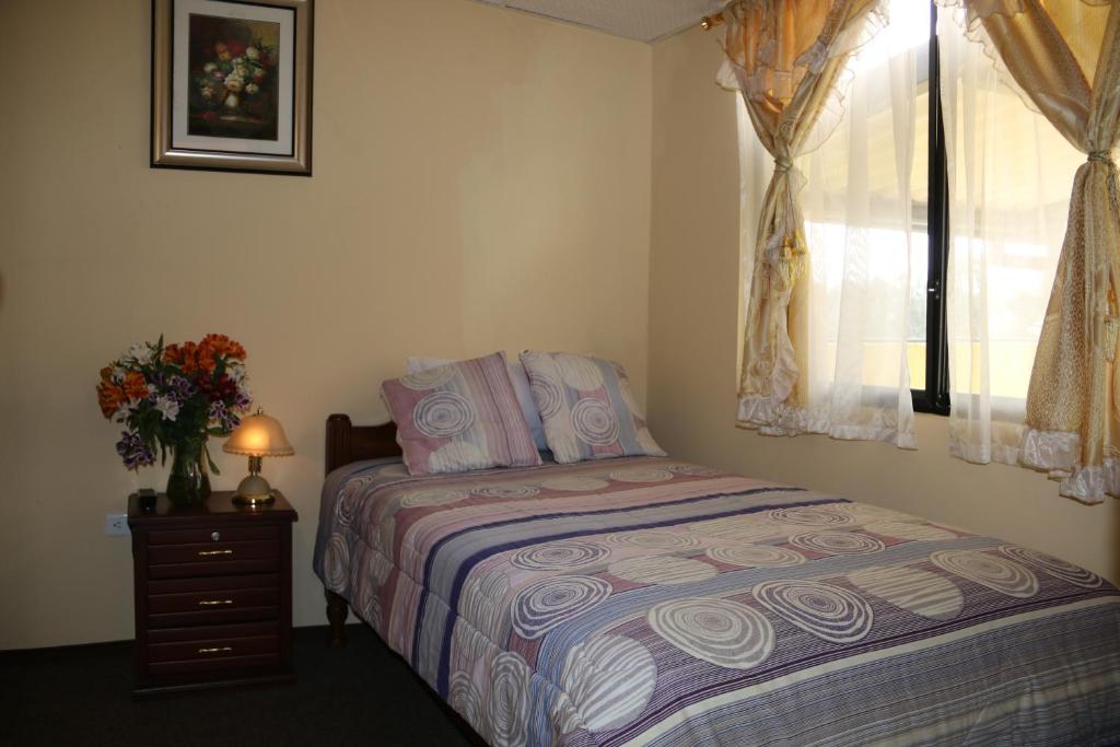 Postel nebo postele na pokoji v ubytování Hotel Residencial El Viajero
