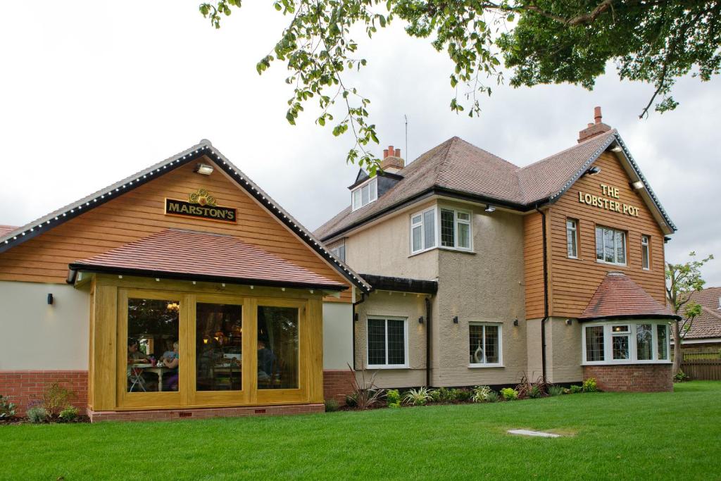 a house with a store in a yard at Lobster Pot, Bridlington by Marston's Inn in Bridlington