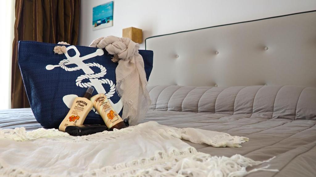 a bedroom with a bed with two pillows on it at Lagomandra Hotel and Spa in Lagomandra