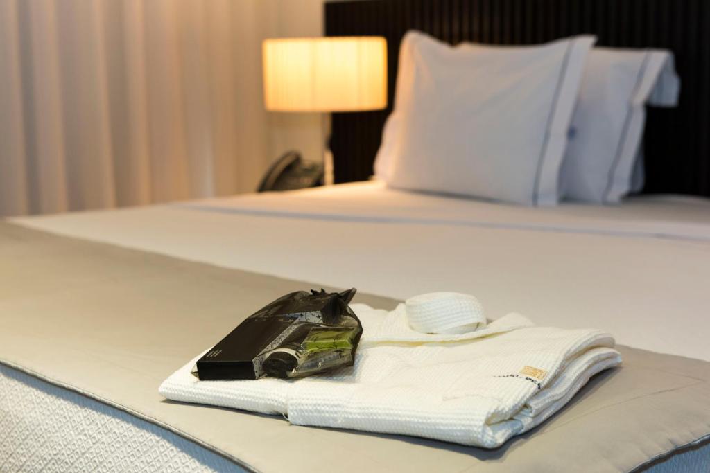 Postel nebo postele na pokoji v ubytování Hotel Pérola