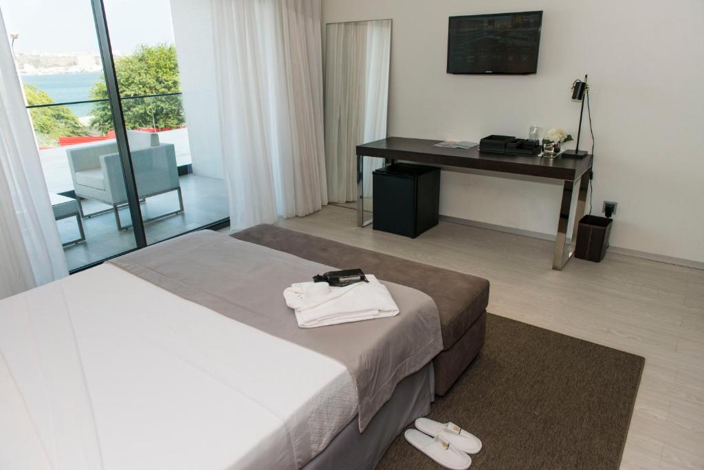 Postel nebo postele na pokoji v ubytování Hotel Pérola