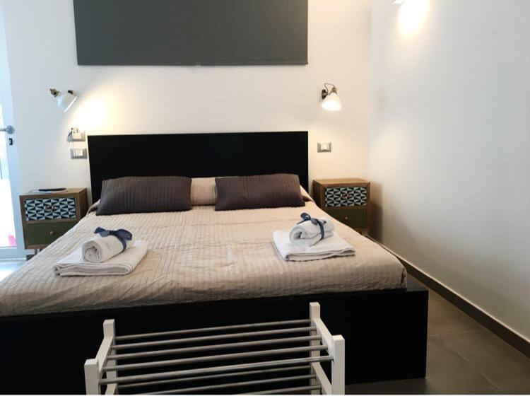 Postel nebo postele na pokoji v ubytování Corte Sveva B&B Affittacamere