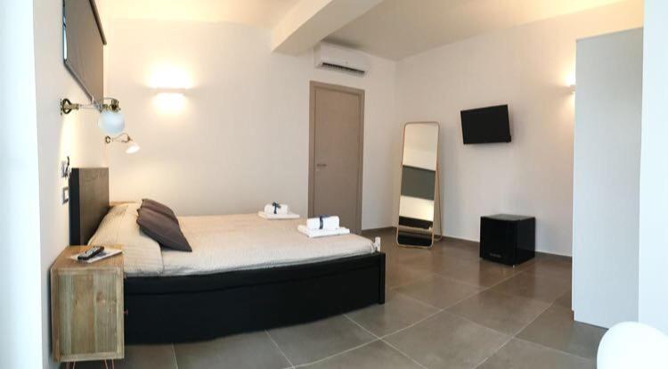 Postel nebo postele na pokoji v ubytování Corte Sveva B&B Affittacamere