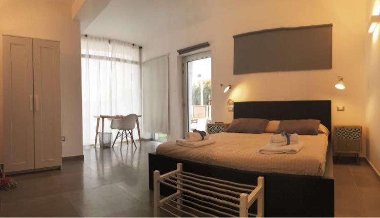 Postel nebo postele na pokoji v ubytování Corte Sveva B&B Affittacamere