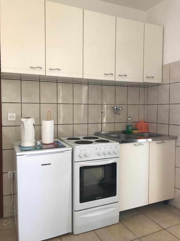Kuchyň nebo kuchyňský kout v ubytování Apartmants Matić