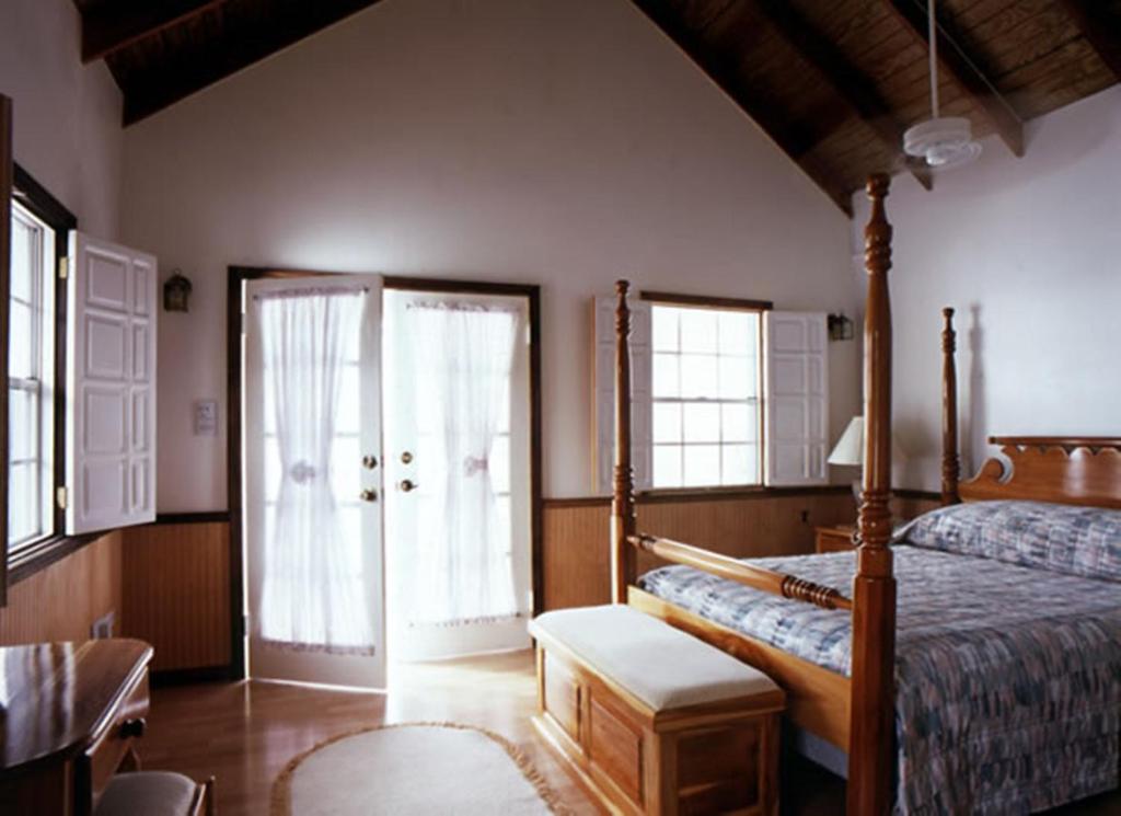 Postel nebo postele na pokoji v ubytování Villa Beach Cottages