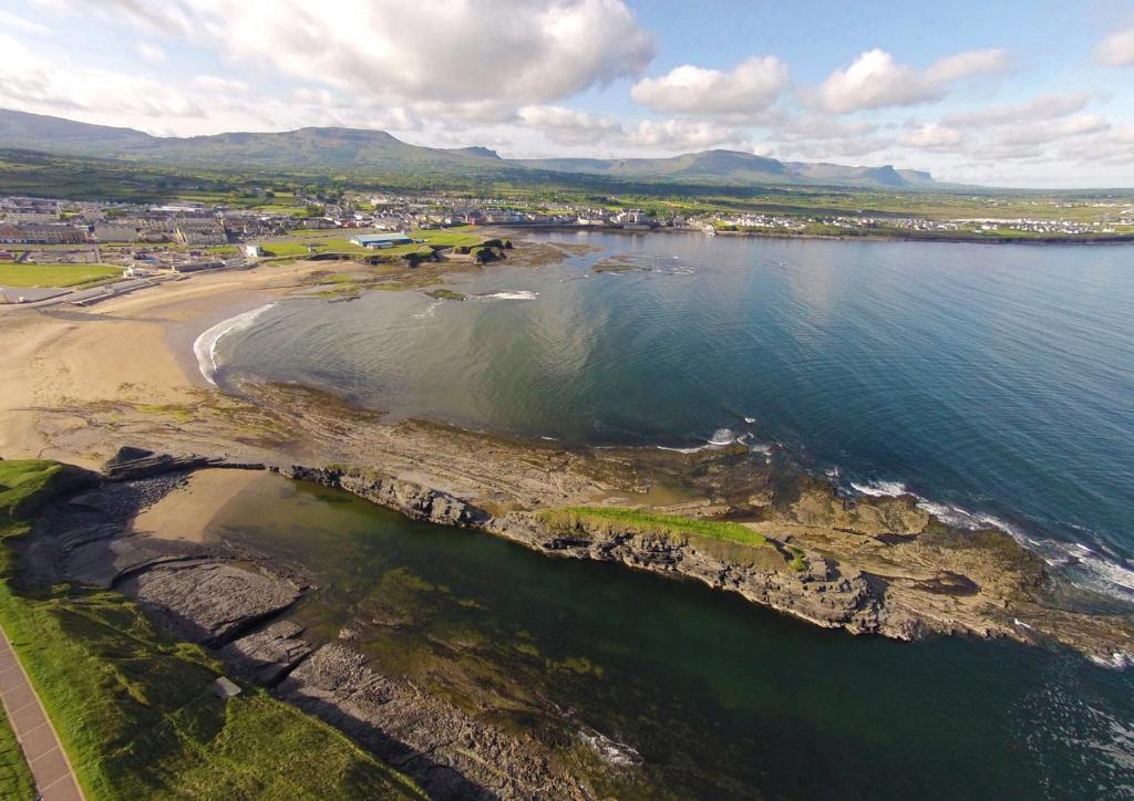 an aerial view of a beach and the ocean at Atlantic Point Stunning Sea View in Bundoran