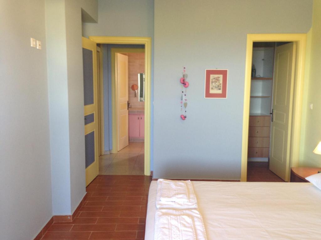 Postel nebo postele na pokoji v ubytování Vila Tselentata