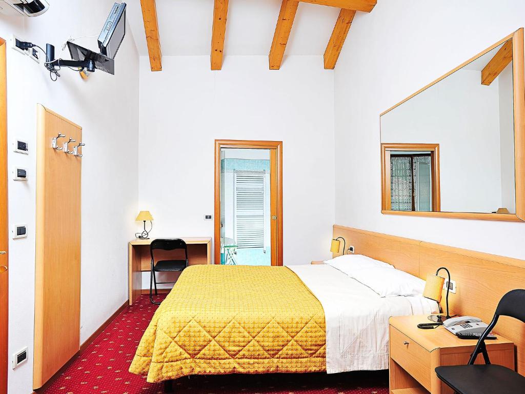 Postel nebo postele na pokoji v ubytování Hotel Doria