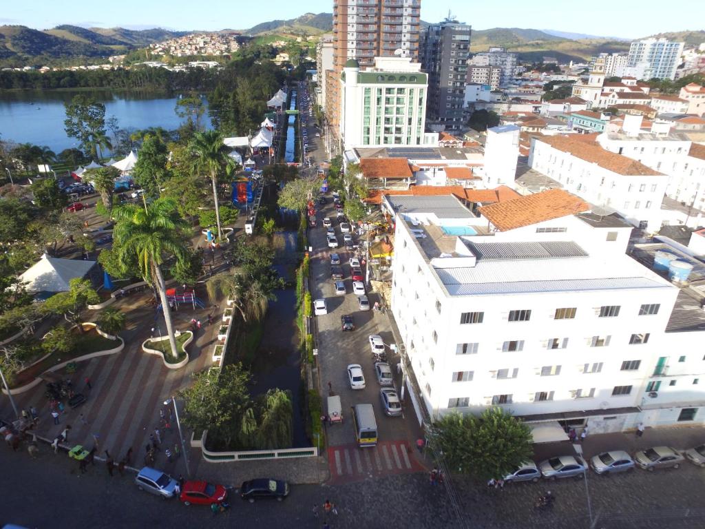 an aerial view of a city with buildings and a street at Hotel Beira Parque in São Lourenço