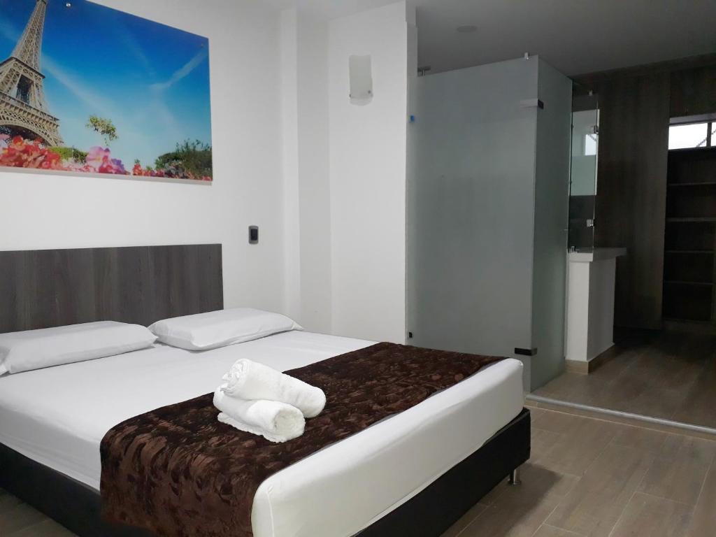 Postel nebo postele na pokoji v ubytování Hotel Jardin de Laureles Jeps