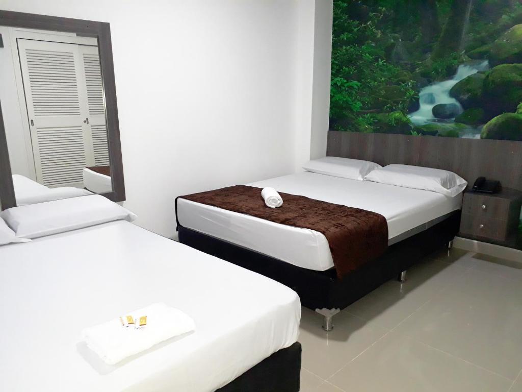 Postel nebo postele na pokoji v ubytování Hotel Jardin de Laureles Jeps