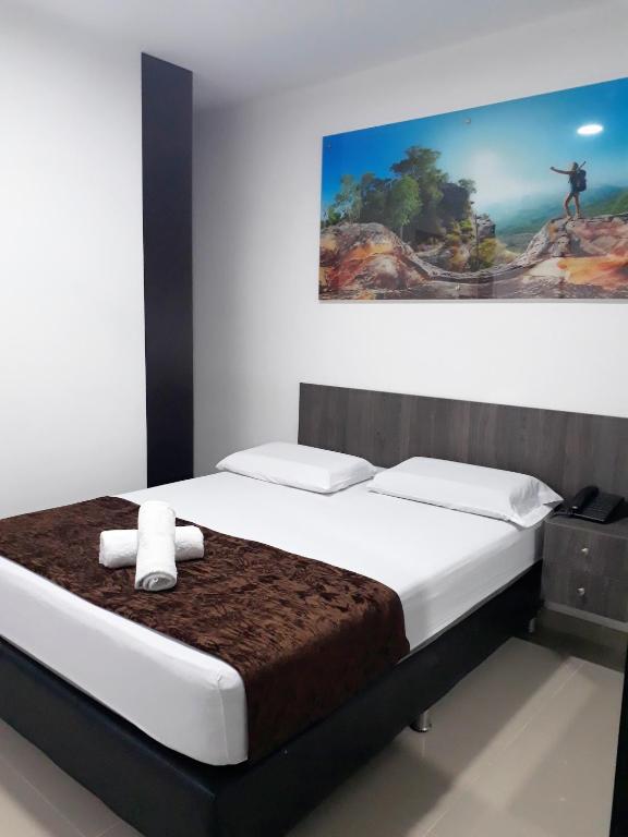 Postel nebo postele na pokoji v ubytování Hotel Jardin de Laureles Jeps