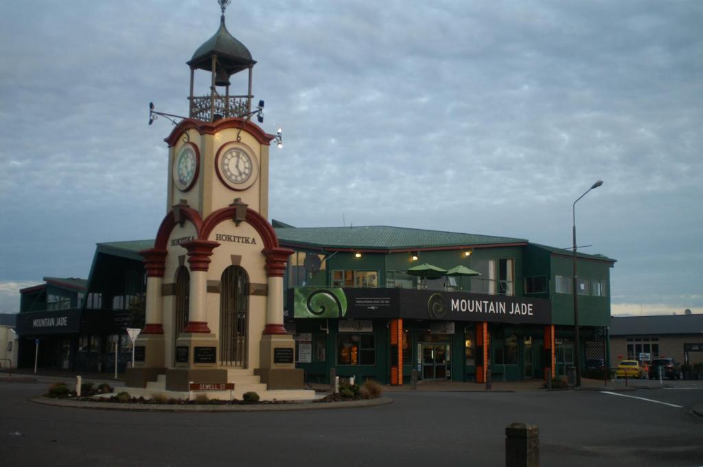 a clock tower in the middle of a city at Mountain Jade Backpackers,Private Rooms & Studios in Hokitika