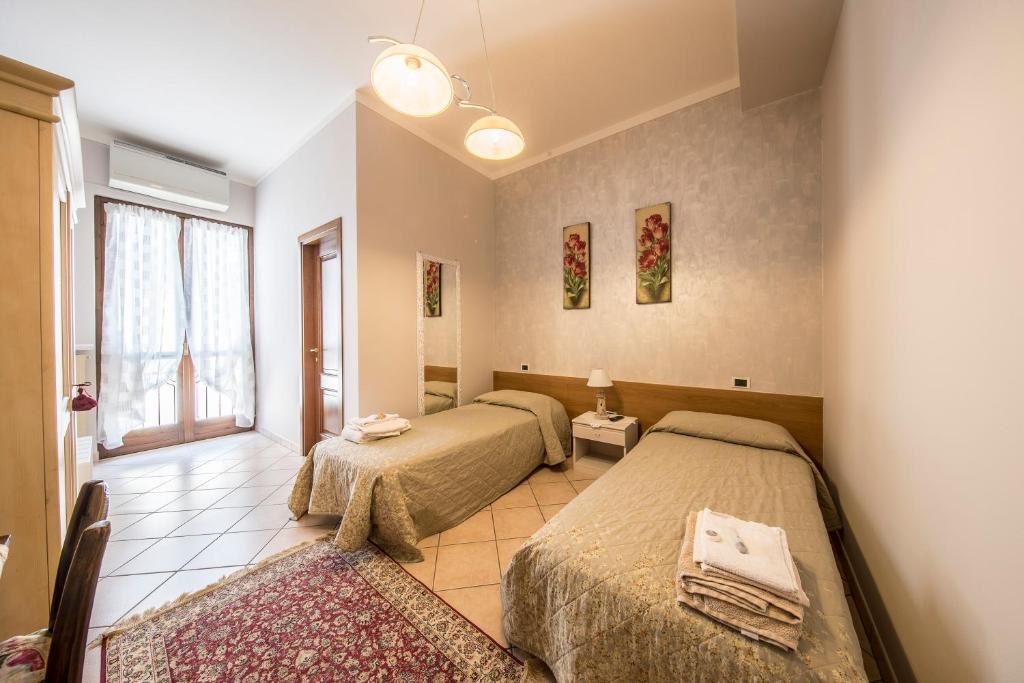 Postel nebo postele na pokoji v ubytování Trattoria Milani
