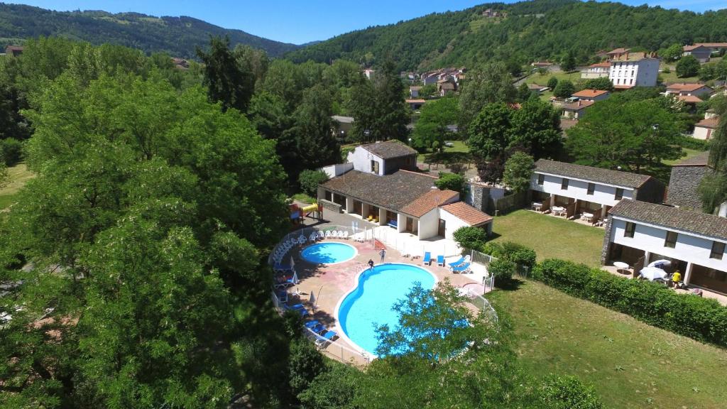 an aerial view of a house with a swimming pool at VVF Les Gorges de l'Allier in Lavoûte-Chilhac