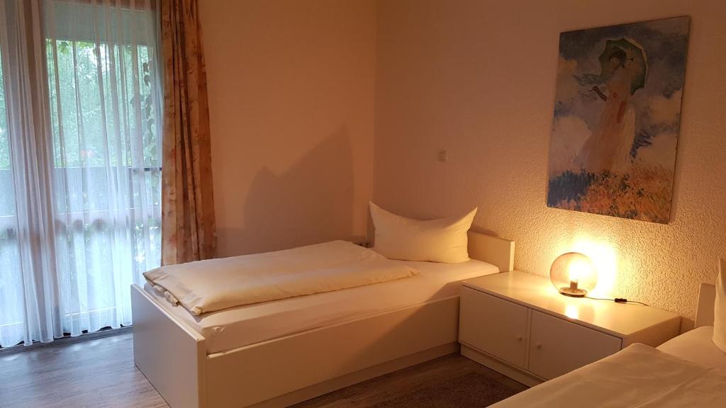 Postel nebo postele na pokoji v ubytování Schneiderlein Hotel