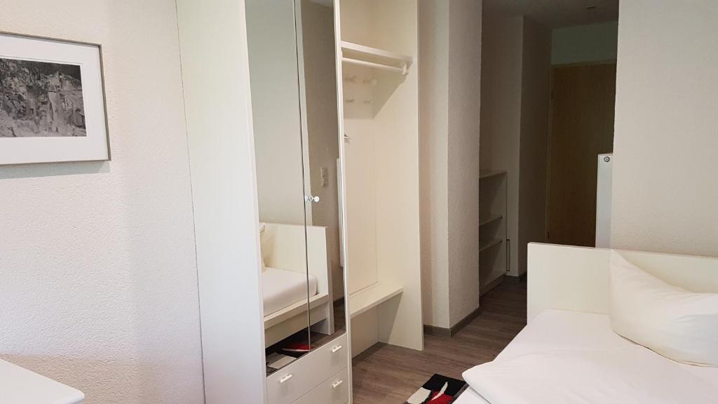 Postel nebo postele na pokoji v ubytování Schneiderlein Hotel