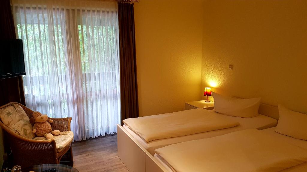 Postel nebo postele na pokoji v ubytování Schneiderlein Hotel