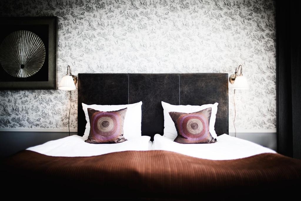 Postel nebo postele na pokoji v ubytování Freys Hotel