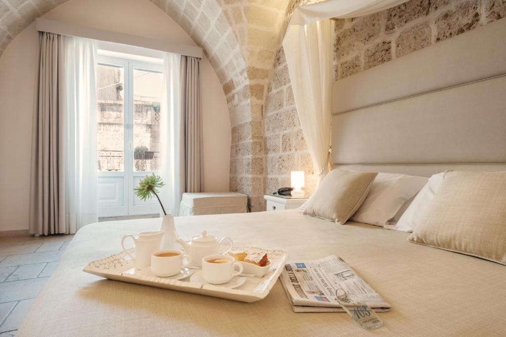 Postel nebo postele na pokoji v ubytování Hotel L'Arcangelo - Boutique Hotel
