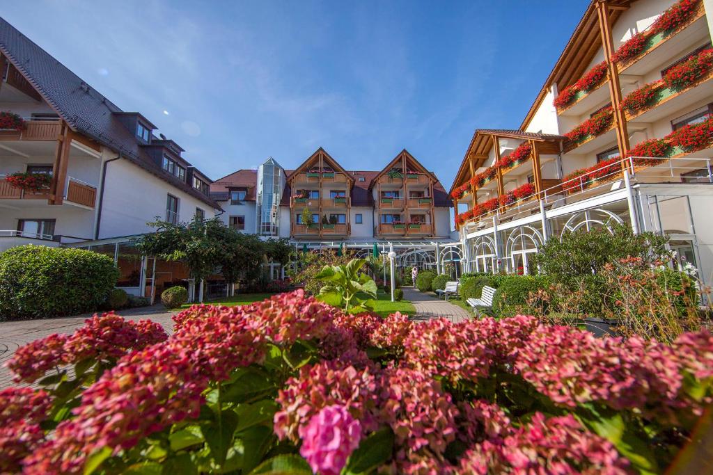 a bunch of flowers in front of some buildings at Ringhotel Krone in Friedrichshafen